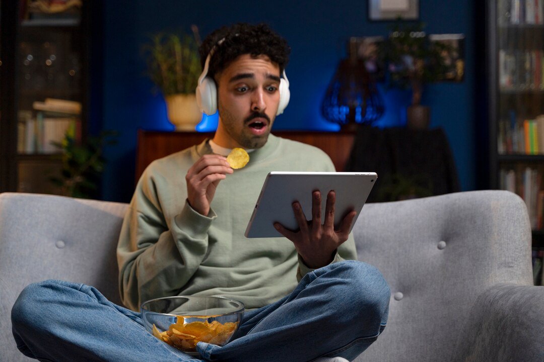 young-man-enjoying-movie-night_23-2149307345